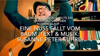 Video thumbnail of "Eine Nuss fällt vom Baum (Text & Musik: Susanne Peter-Führe) hier mal interpretiert v. Jürgen Fastje"