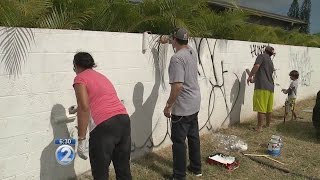 Emotional father of son killed in moped accident cleans up vandalized memorial