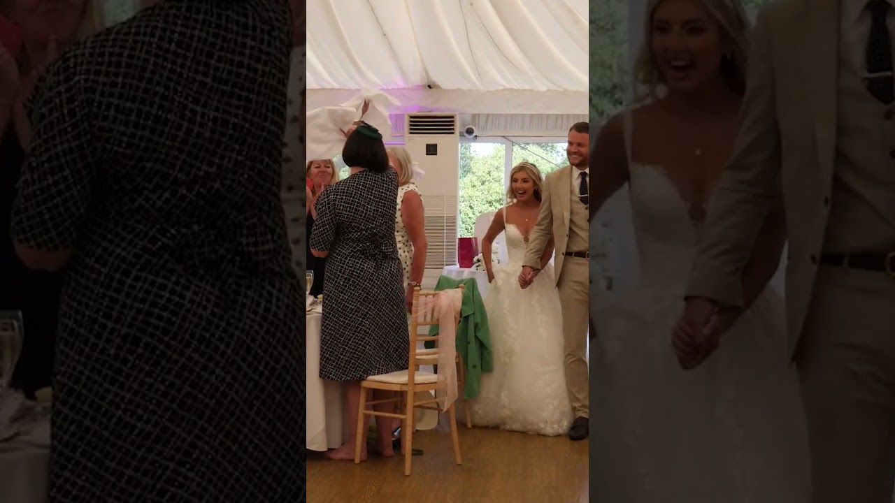 Couple Enter The Wedding Breakfast