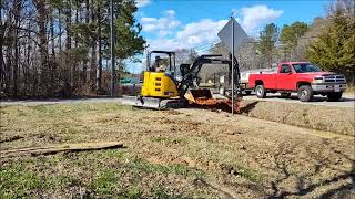 John Deere 35G installing culvert pipe