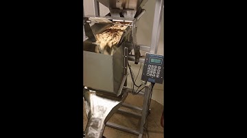 The Logical Machines Model S-4 Automatic Scale System filling .5lbs Animal Crackers.