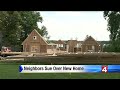 Neighbors sue over new home