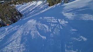 Skiing down a short black piste