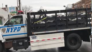 NYPD TRANSPORT TRUCK TRANSPORTING A GROUP OF NYPD SCOOTER PATROL MOTORCYCLES IN BROOKLYN, NEW YORK.