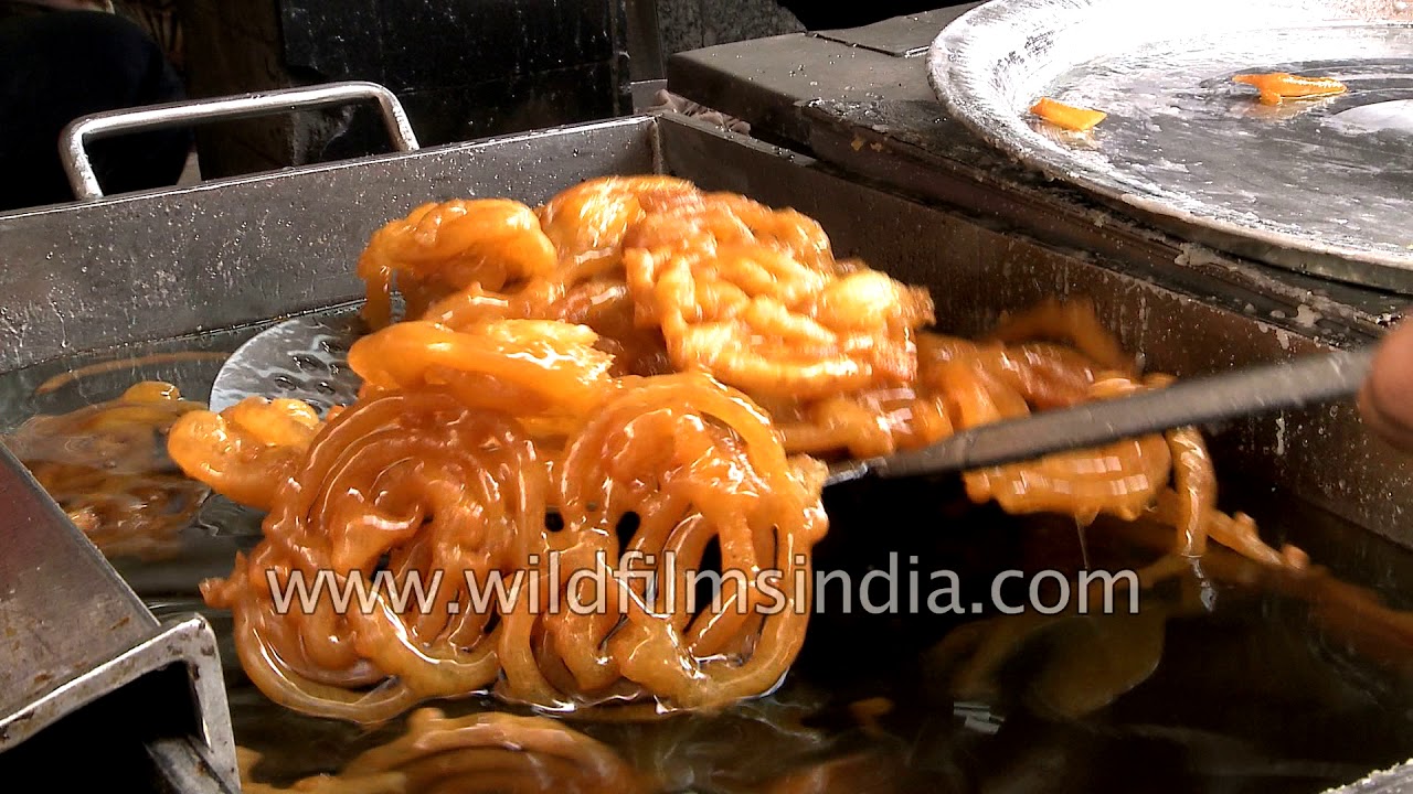 nepal flag Old Famous Jalebi Wala: Sweet kiosk making jalebi dipped in saffron laced sugar syrup