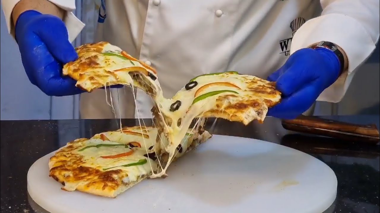 طريقه تحضير البيتزا في المنزل بشكل مميز إعداد الشيف نعيم ابو الكص