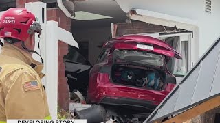 Tesla smashes through fence into Clairemont home