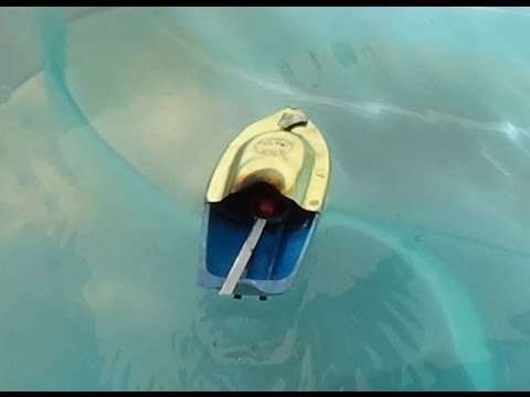 Toy Boat in water using fire for engine power and lots of ...