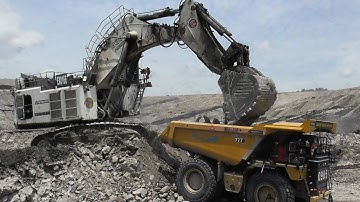 Liebherr R9350 Excavator Loading Overburden On Komatsu HD785 & CAT 777 Dumpers