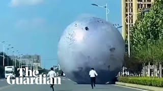 Rolling news: giant moon model escapes from festival in China