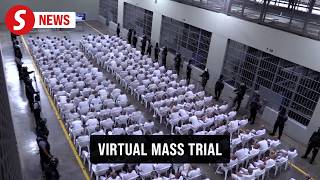 Hundreds of alleged gang members in El Salvador's mega-prison face justice in virtual mass trial