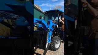 My daughter learns to use a grapple on the LS Tractor