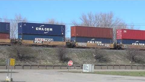 Fast CSX Double Stack Train Eastbound on Raised Tracks