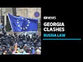 Violent clashes in georgia as russia law passes parliament  abc news