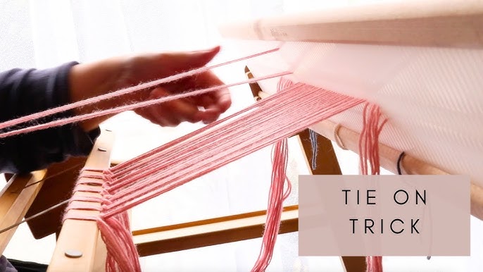 Weaving with loops on the potholder loom.AVI 