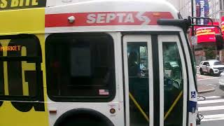 SEPTA BUS ROUTE 23 AND AN OLD CAR CROSSING MARKET STREET