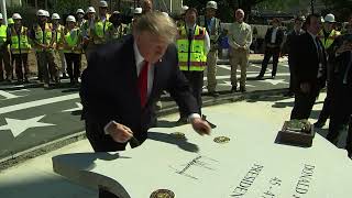 Donald Trump signs stone for new White House helipad