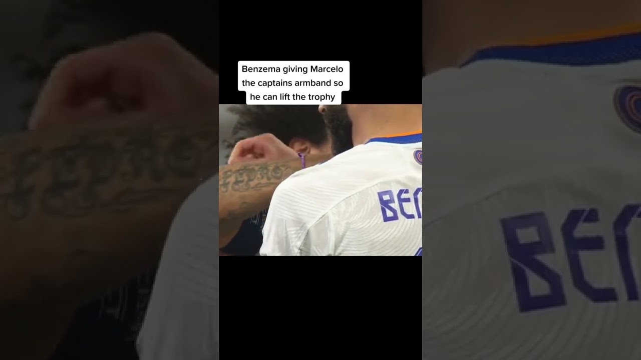Benzema giving Marcelo Captain armband so he can lift the trophy 