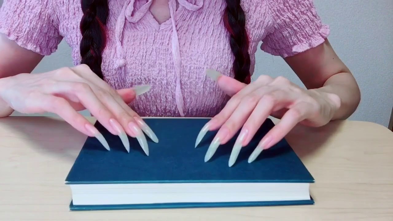 ASMR-long nails. Tapping and scratching the book cover.