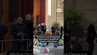 Michel Drucker et Catherine Deneuve à la sortie de l’église pour les obsèques de Nathalie Baye