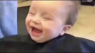 Cute babies laughing while having a hair cut