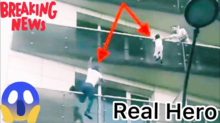 SpiderMan Scrambles Up Building To Save A Dangling Child. Paris Spider-Man - Malian Hero