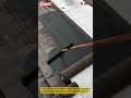 Spreading Roof Sealant using Coating Brush for Waterproof Surface Protection