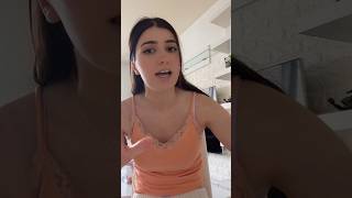 Woman in orange tank top, no bra, sexy with visible nipples, brown color