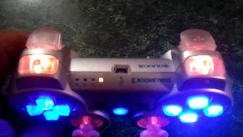 silver controller w blue and orange.mp4