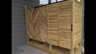 Outdoor Shower with Barn Door Made from Cedar Fence Planks LP Gas Water Heater