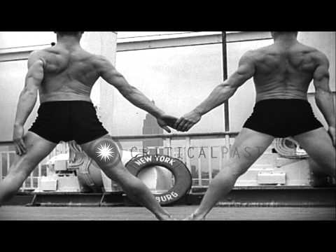 Gymnasts from the Niels Bukh School of Gymnastics demonstrate individual and coll...HD Stock Footage Gymnasts from the Niels Bukh School of Gymnastics demonstrate individual and coll...HD Stock Footage