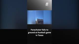 Parachuter falls to ground at football game in Texas