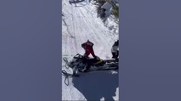 Snowmobile Hits a Skier!