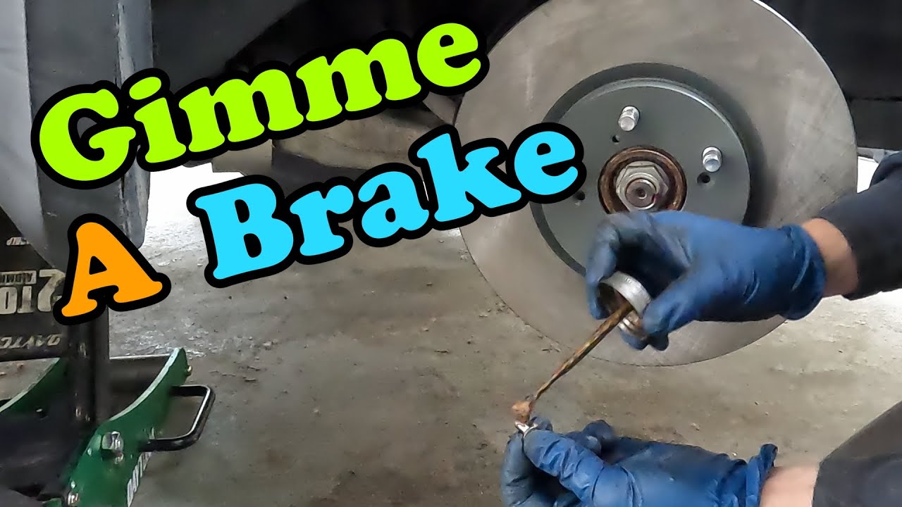 Замена передних тормозных колодок и роторов Honda Pilot 2009-2015 гг.