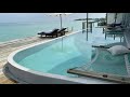 Maldives life art - enjoying Soneva Jani one bedroom water villa with slide.