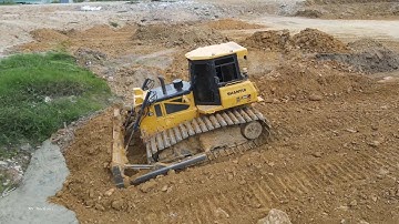 Awesome mighty machines operating skill large pond fill up with soil bulldozer and trucks in Action