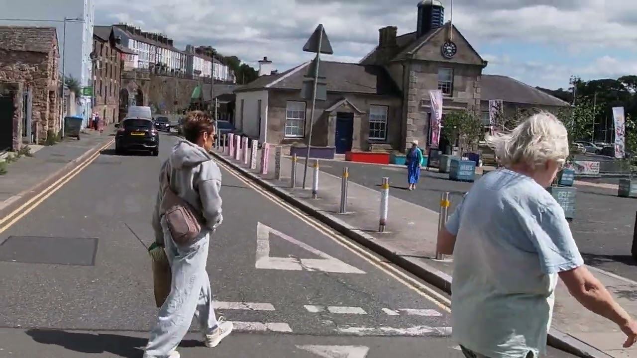 5 WALK  FROM  THE  BUS  STOP  AROUND  CAERNARFON  CASTLE  NORTH  WALES  UK  .