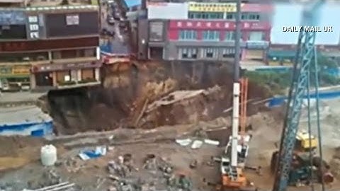 Caught on camera: Huge sinkhole opens