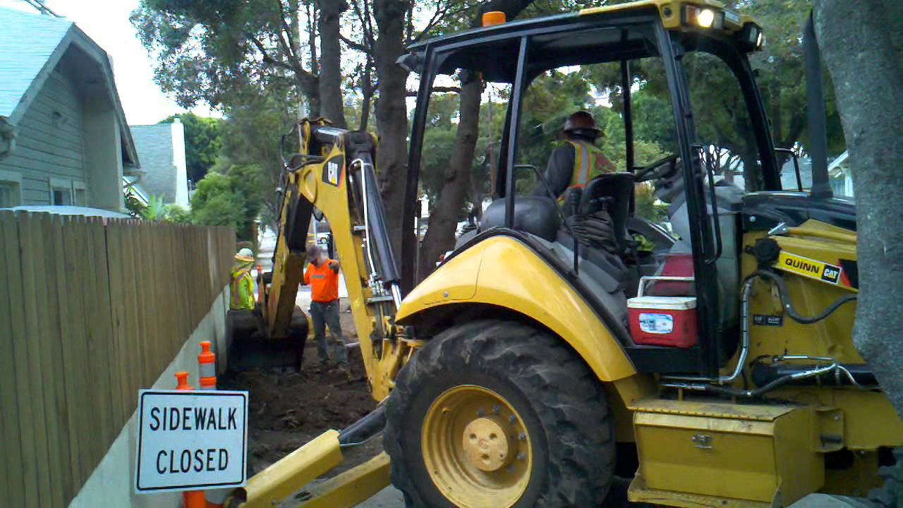 Backhoe loader at work - YouTube