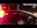 Woman charged after alleged near-collision with police car