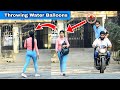 Throwing water balloons from bike  part 3  prakash peswani prank 