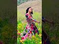 Doja and Post Malone dancing in a field