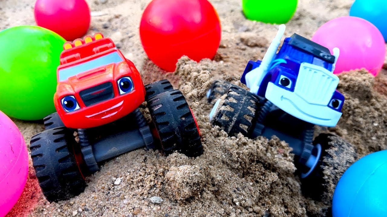 Blaze and the Monster Machines toys in the Sandbox: Toy monster trucks in mud