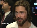 Brad Pitt talks to reporters at the premiere of Johnny Suede 2