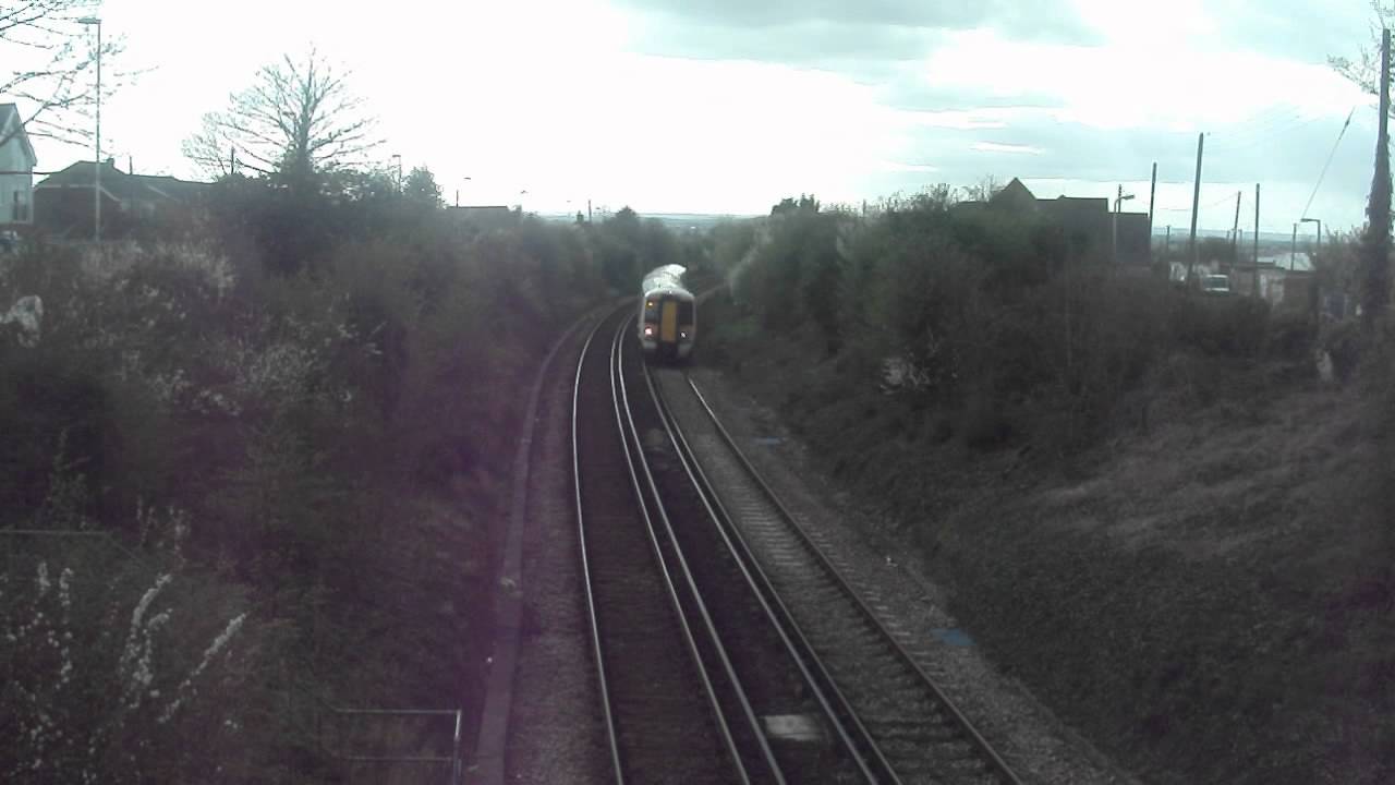 Southeastern 375902 passing Whitstable Footbridge
