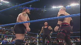 Undertaker saves Rey Mysterio from Big Show and Kane