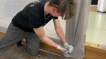 Stretching the large tufting cloth