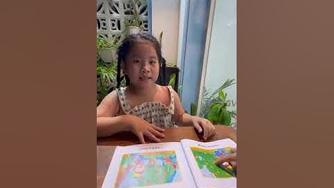 Tiếng Anh Giao Tiếp Thiếu Nhi Tại Phan Thiết: Nancy reading a book called Greedy Monkey