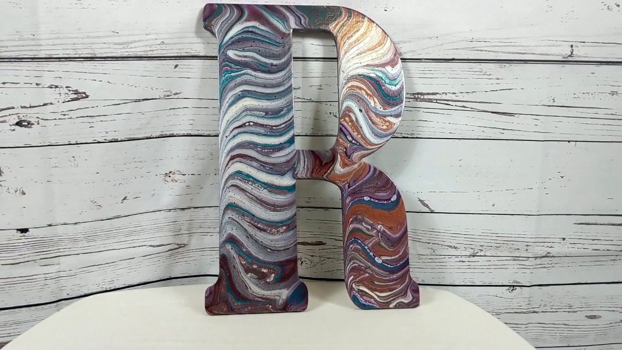 Acrylic pouring on a wooden letter