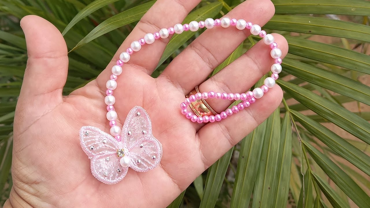 Prendedor de chupeta com pérolas